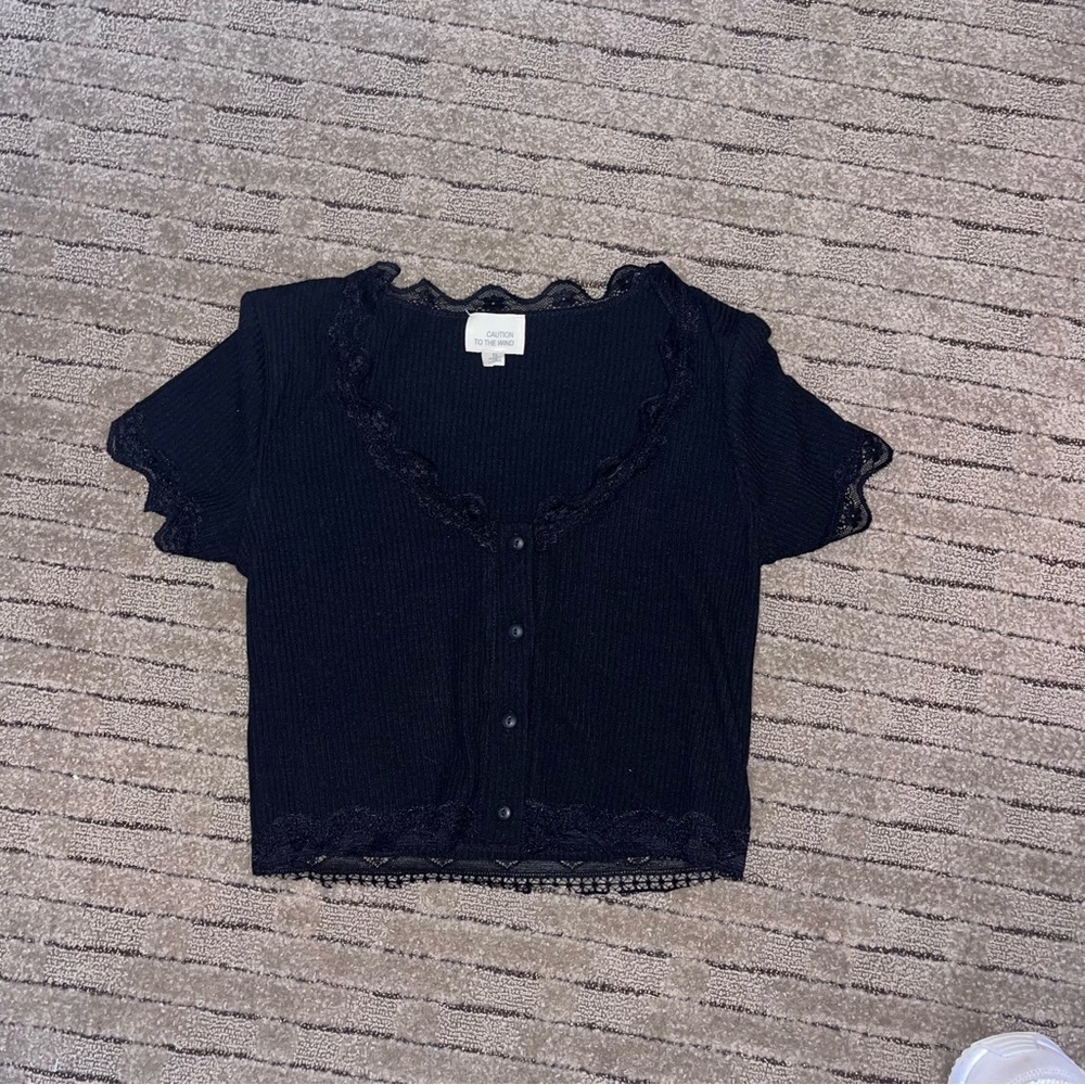 Chic Black Lace-Trimmed Top by Caution to the Wind
